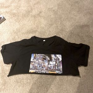 This is a small black crop top with the wonderful scenery of New York City